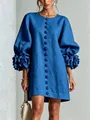Detailed view of a French blue cotton linen dress featuring 3D flower lantern sleeves - Sapphire Blue