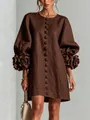 Detailed view of a French style brown cotton linen dress with 3D floral lantern sleeves - Coffee