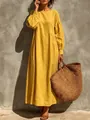 Full-body view of a yellow resort maxi dress styled with a woven bag and sandals - Yellow