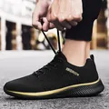 Comfortable black flyknit running shoes for men featuring a stylish gold sole line - 38 / Black & Gold