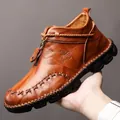 Men's brown leather high-top Martin boots with thick soles and cross-stitched toe detail. - 38 / Brown (865)