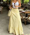 High-waisted yellow gingham maxi skirt with a ruffled hem, perfect for casual holiday style. - XS / Bottoms / Yellow