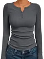 Close-up of women's grey ribbed Henley shirt showing texture and button neck detail - S / Tops / Dark Gray