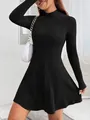 Detailed shot of a black slim fit ribbed long sleeve A-line dress with a high neck - S / Dresses / Black