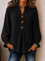 Detailed view of women's black long-sleeve V-neck blouse with decorative wood buttons - S / Tops / Black