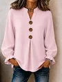 Detail of pink V-neck blouse with decorative wooden buttons and ruffled cuffs - S / Tops / Pink