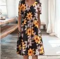 Close-up detail of a short sleeve A-line dress with a vibrant sunflower print pattern - S / Dresses / Color 9 (Black Sunflower)