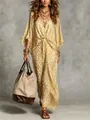 Detailed shot of a leopard print V-neck maxi dress with elegant cinched waistline - Yellow