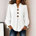 Elegant white long sleeve V-neck blouse featuring stylish button details and ruffles - S / Tops / White