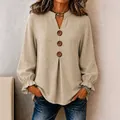 Women's beige long-sleeve V-neck blouse with decorative buttons and ruffled cuffs - Khaki