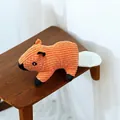 Detailed close-up showing the textured corduroy fabric of a cartoon squirrel squeaky dog toy - Orange Squirrel