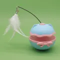 Electric tumbler cat toy in blue and pink with white feather and bell attachment - Blue