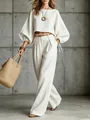 Full view of white lantern sleeve crop top and matching high-waisted wide-leg trousers outfit - S / Top And Bottom / Off White