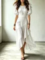 Detailed view of elegant white dress with puff sleeves and asymmetric ruffled hemline - XS / Dresses / White