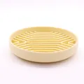 Durable light yellow silicone slow feeder bowl for dogs featuring internal maze texture - Beige