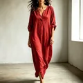 Close-up detail of a red loose-fit V-neck maxi dress with adjustable 3/4 sleeves - XS / Dresses / Red