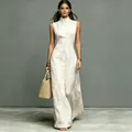 Elegant minimalist off-white sleeveless maxi dress with high collar and front buttons - Off White