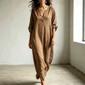 Close-up of loose brown V-neck maxi dress with roll-tab sleeves and linen texture - XS / Dresses / Khaki