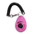 Pink pet training clicker tool featuring a black coiled wrist strap for dog obedience training - Pink