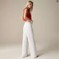 Side view of elegant white wide-leg high-waisted denim jeans shown on a female model - XS / Cropped Pants (Bottom) / White