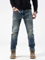 Jeans slim in denim blu da uomo con finitura lavata e dettagli usurati alla moda - Blu scuro