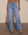 Close-up detail of women's vintage blue straight wide-leg jeans with patch pockets - S / Bottoms / Light Blue