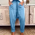 Detailed view of women's blue casual drop-crotch harem pants featuring a drawstring waist - S / Blue