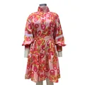 Detailed front view of a pink floral high-neck shirt dress with lace sleeve accents - S / Dresses / Red