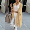 Detail view of women's beige knit cardigan with a loose irregular hem design - S / Tops / Apricot