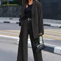 Full view of an elegant black long sleeve blazer and wide-leg trousers suit set - S / Top And Bottom / Black