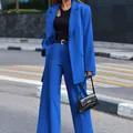 Street style view of women's vibrant blue 2-piece blazer and wide-leg trousers suit - S / Top And Bottom / Blue