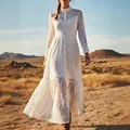 Detailed view of a white vintage bohemian lace long sleeve maxi dress in a desert landscape - S / Dresses / White