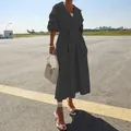 Stijlvolle zwarte dames trenchcoat met lange mouwen en een verstelbare ceintuur. - S / Tops / Zwart