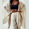 Detail of women's beige cotton linen two-piece loungewear set showing loose fit - S / Top And Bottom / Off White