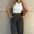 Detailed view of elegant high-waisted dark grey trousers with a stylish brown belt - S / Bottoms / Black