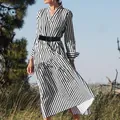 Elegant black and white vertical striped long sleeve midi dress with a stylish V-neck cut. - S / Dresses / Black