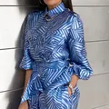 Detailed view of stylish blue and white palm leaf print shirt with gold buttons - S / Top And Bottom / Blue