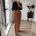 Detail view of brown high-waisted straight trousers with black side stripes suit style - S / Bottoms / Coffee