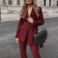 Elegant woman wearing burgundy two-piece suit set with waist tie on city street - S / Top And Bottom / Burgundy