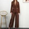 Full view of women's brown blazer and wide-leg trousers set with elegant white piping - S / Top And Bottom / Coffee