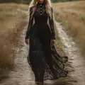 Elegant vintage black lace long sleeve maxi dress presented in a rustic outdoor field setting - S / Dresses / Black