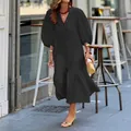 Elegant black loose-fitting midi dress with stylish puff sleeves for a casual vacation look. - S / Dresses / Black