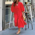 Vibrant red puff sleeve midi dress shown in a stylish outdoor street setting - S / Dresses / Red