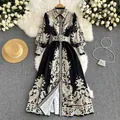 Elegant black long-sleeved paisley print maxi shirt dress with matching waist belt layout. - S / Dresses / Black