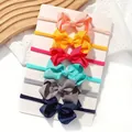Set of 6 colorful solid elastic bow headbands for toddlers in various vibrant colors - Style D (Code)