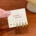 Elegant 6-piece gold earring set including studs and hoops displayed on white card - Golden Copper Coin Style (EKT025)