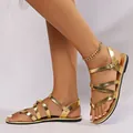 Elegant gold metallic cross-strap flat Roman sandals for women beach footwear - 36 / Gold