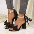 Elegant black chunky heel sandals featuring a large bow and pearl ankle straps detail for women - 35 / Black Style (001)