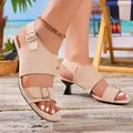 Close-up of beige suede sculptural heel sandals with elegant metal buckles on beach - 35 / Off White