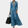 Detailed view of a vintage blue denim maxi dress featuring a button-up front and long sleeves - S / Dresses / Light Blue